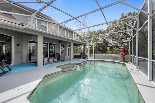 view of pool with a patio, a pool with connected hot tub, a ceiling fan, a lanai, and an outdoor living space