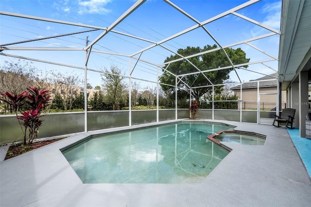 view of swimming pool featuring a patio area, a lanai, a water view, and a pool with connected hot tub