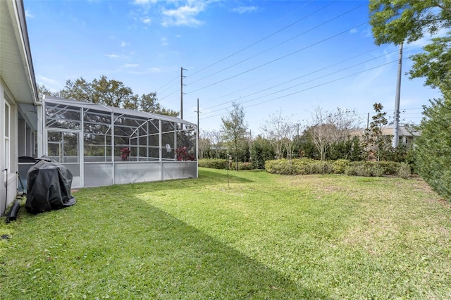 view of yard with a lanai