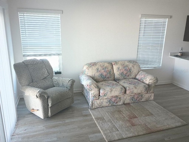 living room with wood finished floors and baseboards