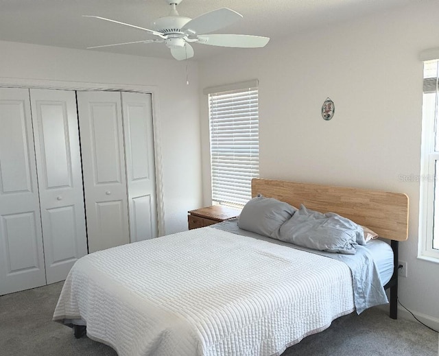 carpeted bedroom with a closet and a ceiling fan