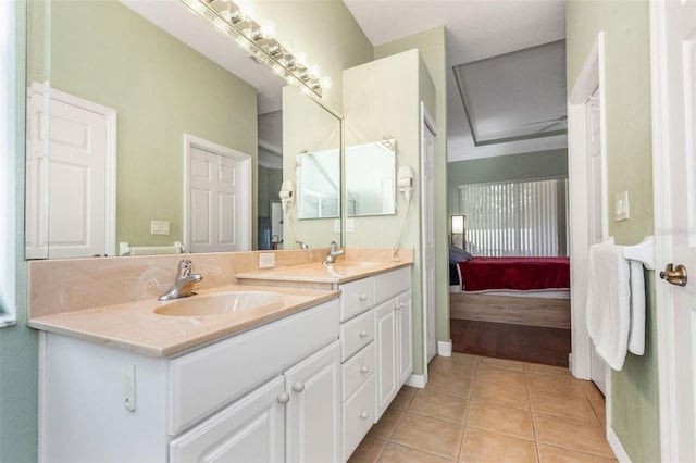 bathroom with double vanity, tile patterned flooring, ensuite bath, and a sink