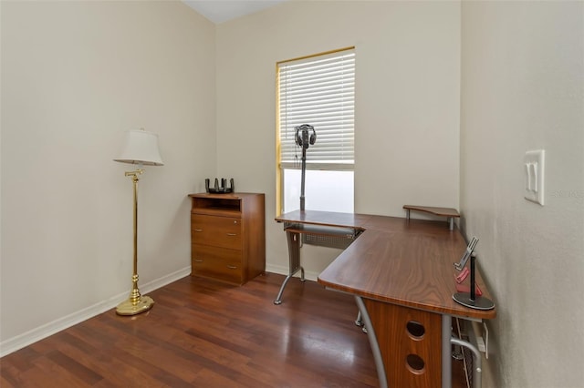 office space with baseboards and dark wood-type flooring