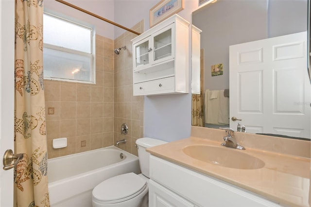 full bathroom with toilet, shower / bath combo, and vanity