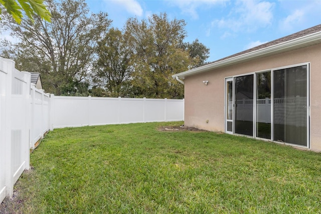 view of yard with a fenced backyard