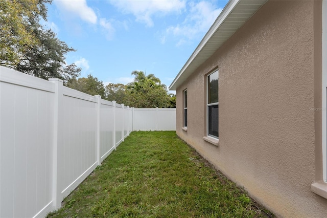 view of yard with a fenced backyard