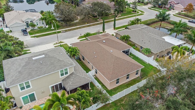 bird's eye view featuring a water view and a residential view