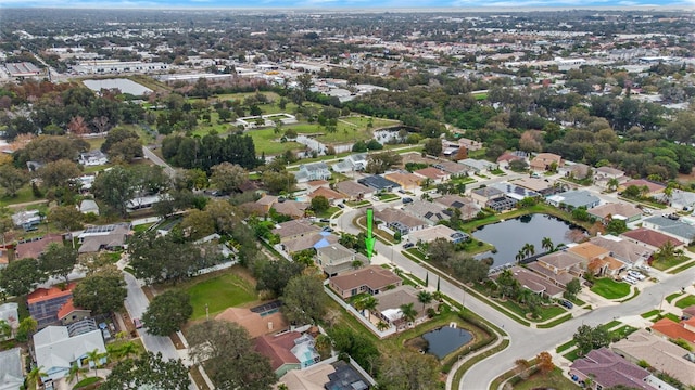 drone / aerial view featuring a water view and a residential view