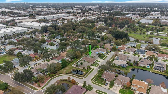 bird's eye view featuring a water view and a residential view