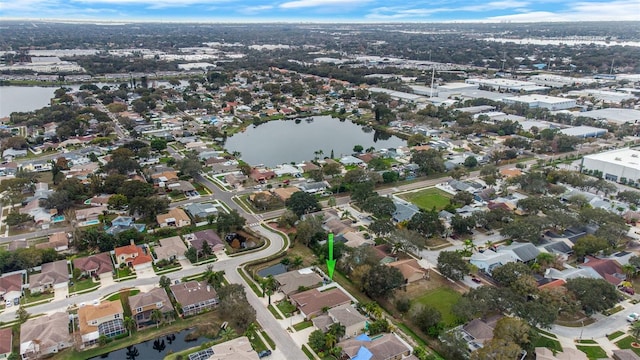 birds eye view of property featuring a water view and a residential view