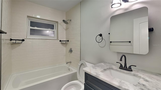 bathroom with shower / bathtub combination, vanity, and toilet