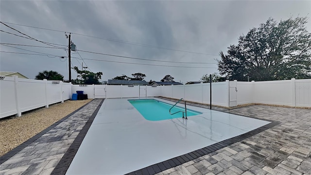 view of pool with a patio area, a fenced backyard, and a fenced in pool