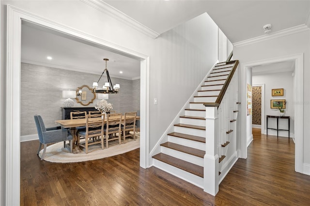 stairs featuring baseboards, wallpapered walls, wood finished floors, and crown molding