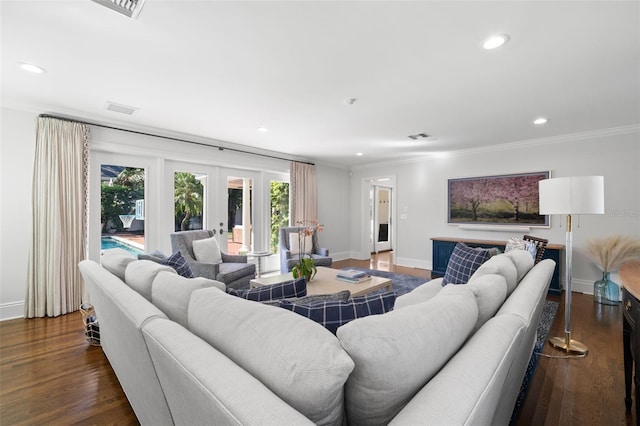 living room featuring baseboards, dark wood-type flooring, and crown molding