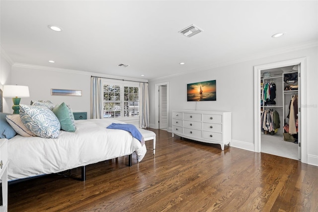 bedroom featuring recessed lighting, visible vents, crown molding, and wood finished floors