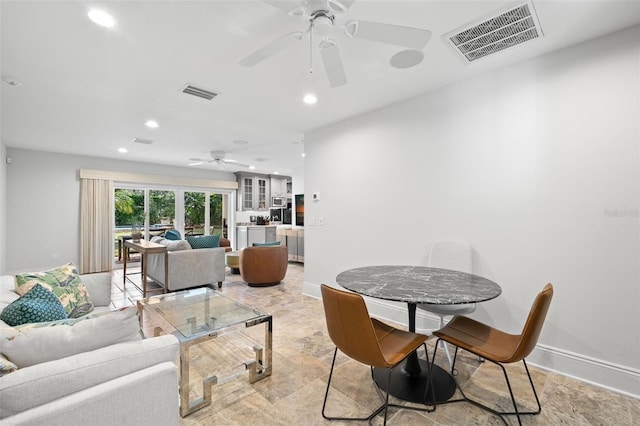 dining area featuring baseboards, visible vents, and recessed lighting