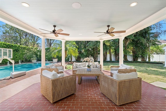 view of patio / terrace with a fenced in pool, a fenced backyard, ceiling fan, and outdoor lounge area