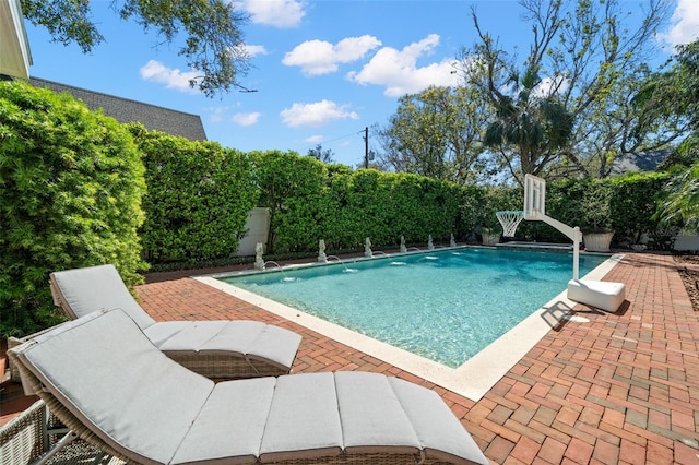 view of pool featuring a patio and a fenced in pool