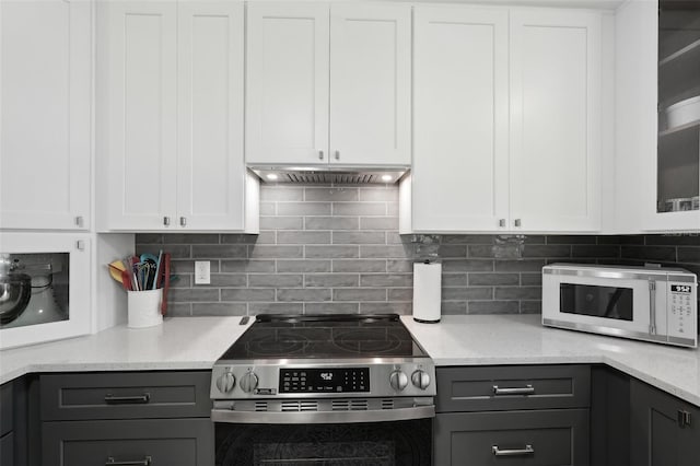 kitchen featuring stainless steel range with electric stovetop, gray cabinets, under cabinet range hood, and white microwave