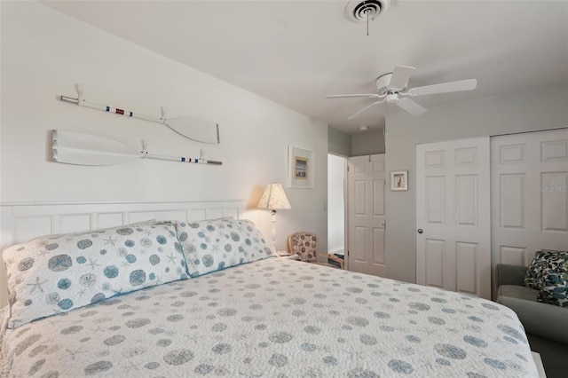 bedroom featuring a closet, visible vents, and a ceiling fan