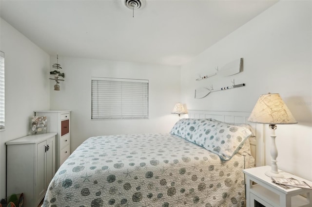 bedroom featuring visible vents