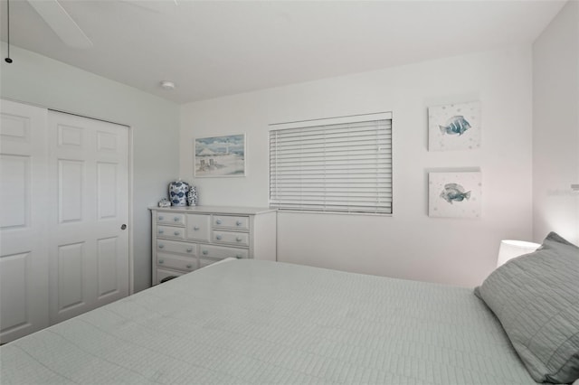 bedroom featuring a closet and a ceiling fan