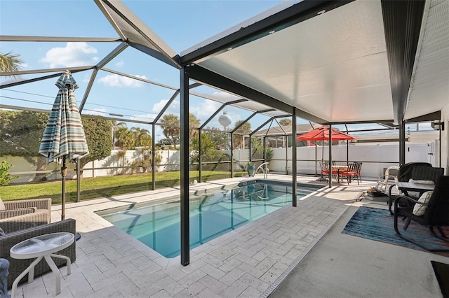 view of swimming pool featuring a fenced in pool, glass enclosure, a patio, and a fenced backyard