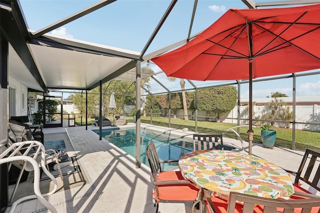 view of swimming pool featuring a patio, outdoor dining area, a lanai, and a fenced in pool