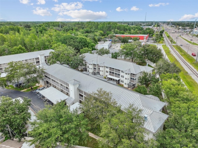 aerial view featuring a wooded view