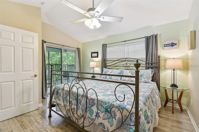 bedroom with ceiling fan, baseboards, vaulted ceiling, and wood finished floors