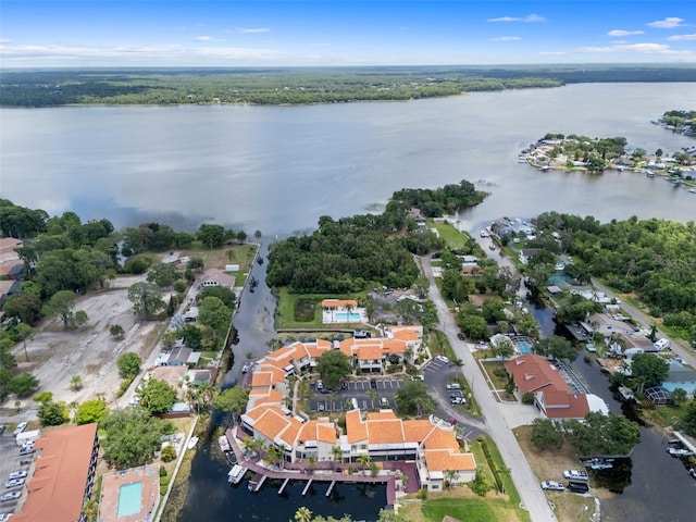 birds eye view of property with a water view