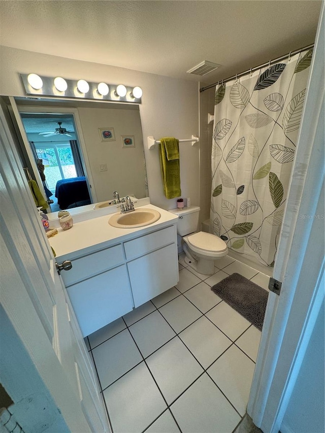 full bath featuring visible vents, a shower with shower curtain, toilet, vanity, and tile patterned floors