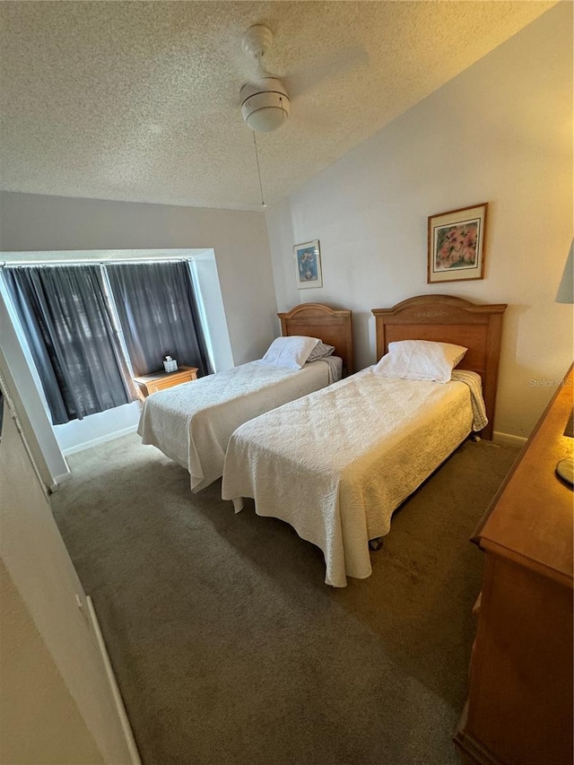 carpeted bedroom featuring lofted ceiling and a textured ceiling