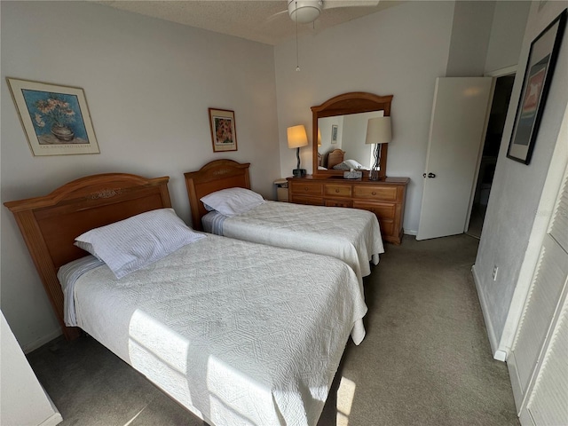 carpeted bedroom featuring baseboards