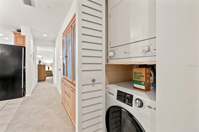 laundry room with laundry area, stacked washer and dryer, visible vents, light colored carpet, and recessed lighting