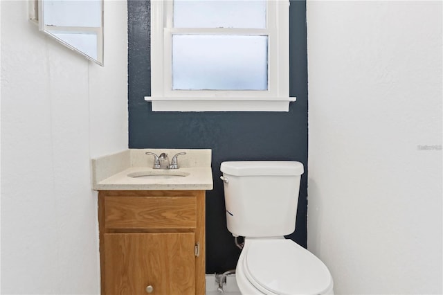 half bath with vanity and toilet