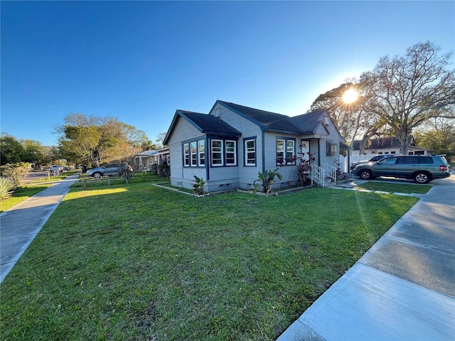 view of side of home featuring a yard