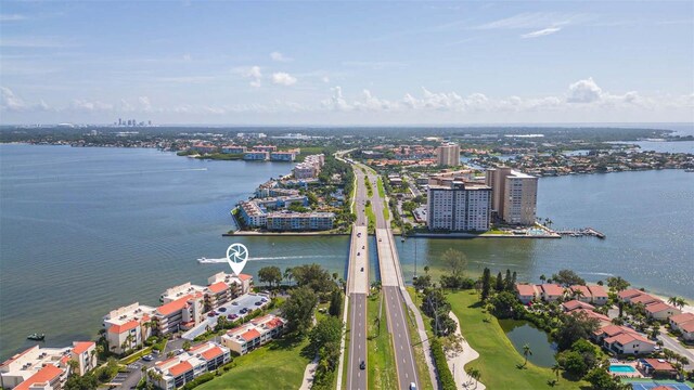 drone / aerial view featuring a view of city and a water view