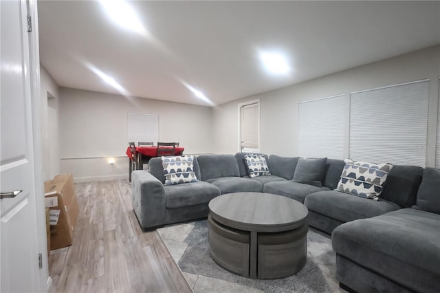 living room featuring light wood-style flooring and baseboards