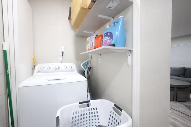 clothes washing area featuring washer / dryer and laundry area