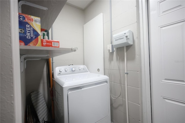 clothes washing area featuring laundry area and washer / dryer