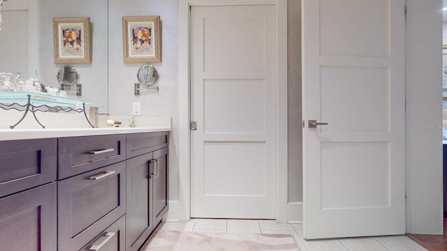 bathroom featuring tile patterned floors and vanity