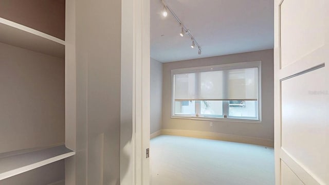 interior space featuring baseboards