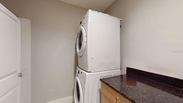 laundry area with stacked washer and dryer