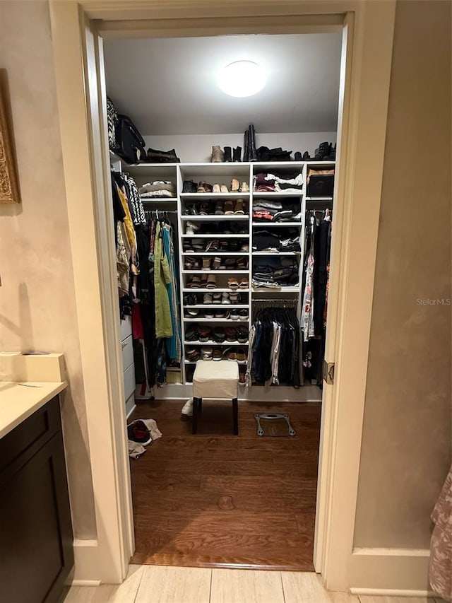 spacious closet featuring wood finished floors