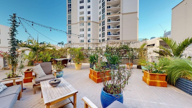 146 4th Ave NE Unit 204, Saint Petersburg, FL 33701 - view of patio / terrace with outdoor lounge area, outdoor dining area, and fence