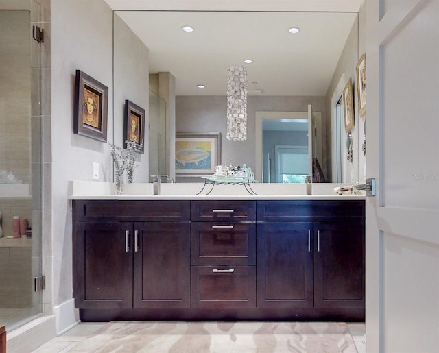 146 4th Ave NE Unit 204, Saint Petersburg, FL 33701 - bathroom with double vanity, a stall shower, and recessed lighting