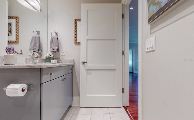 146 4th Ave NE Unit 204, Saint Petersburg, FL 33701 - bathroom with tile patterned floors, vanity, and baseboards