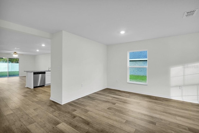 spare room with visible vents, baseboards, a ceiling fan, light wood-style flooring, and recessed lighting