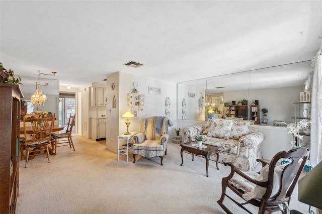 living room with light carpet and visible vents